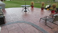 Stamped patio-bluestone tile with rough stone border